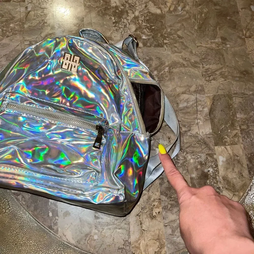 Broken zipper holographic backpack